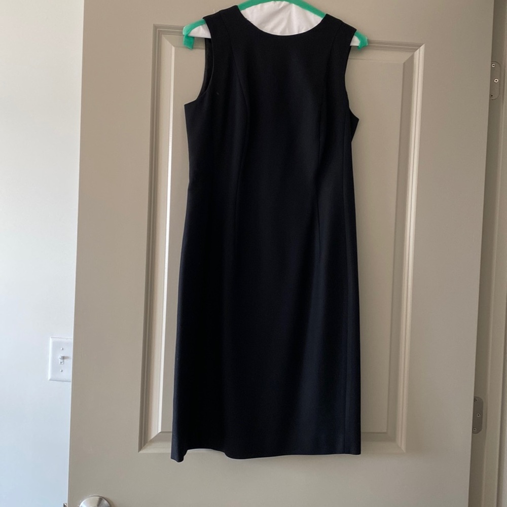Simple black shift; 100% lightweight wool; 28 inches length from armpit